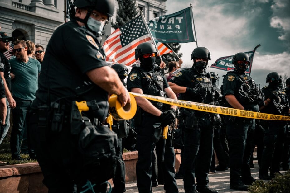 man in black shirt holding american flag